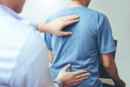 physical therapist and patient with lower back pain