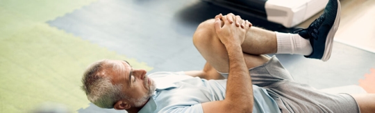 man stretching his leg